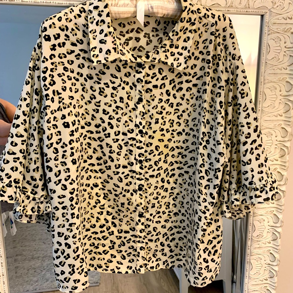 Cheetah polyester blouse with buttons and ruffles so pretty and professional.